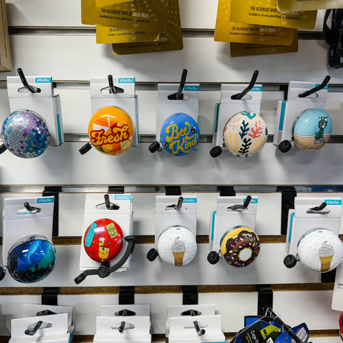 Electra bicycle bells complete collection wall display showing all graphic designs