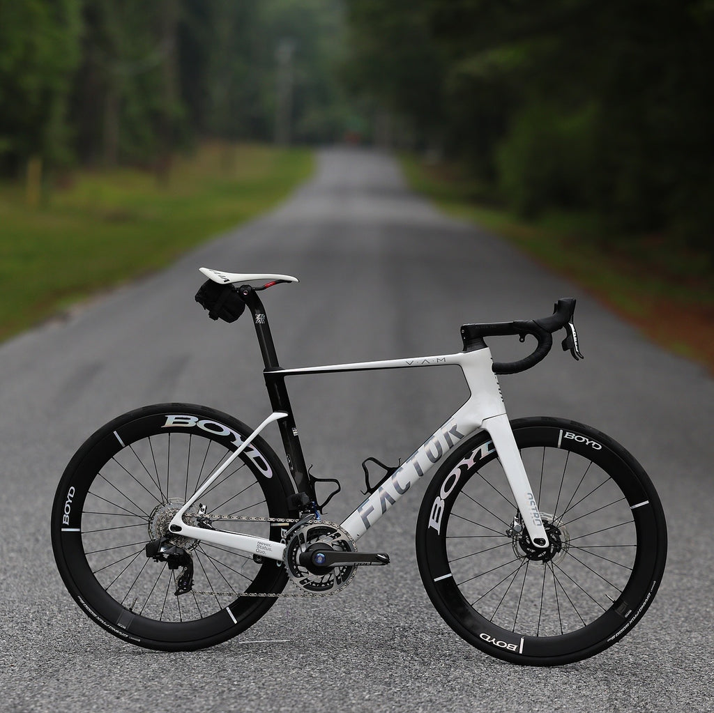 Factor Ostro VAM complete road bike side view with SRAM Red AXS groupset and Boyd carbon wheels