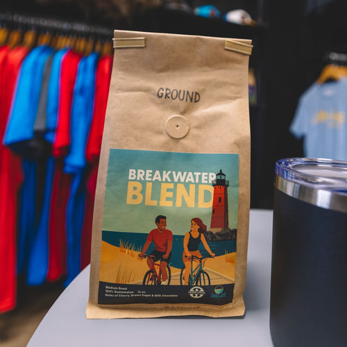 Lewes Cycle Sports Breakwater Blend medium roast coffee bag on table by Swell Joe Coffee Co