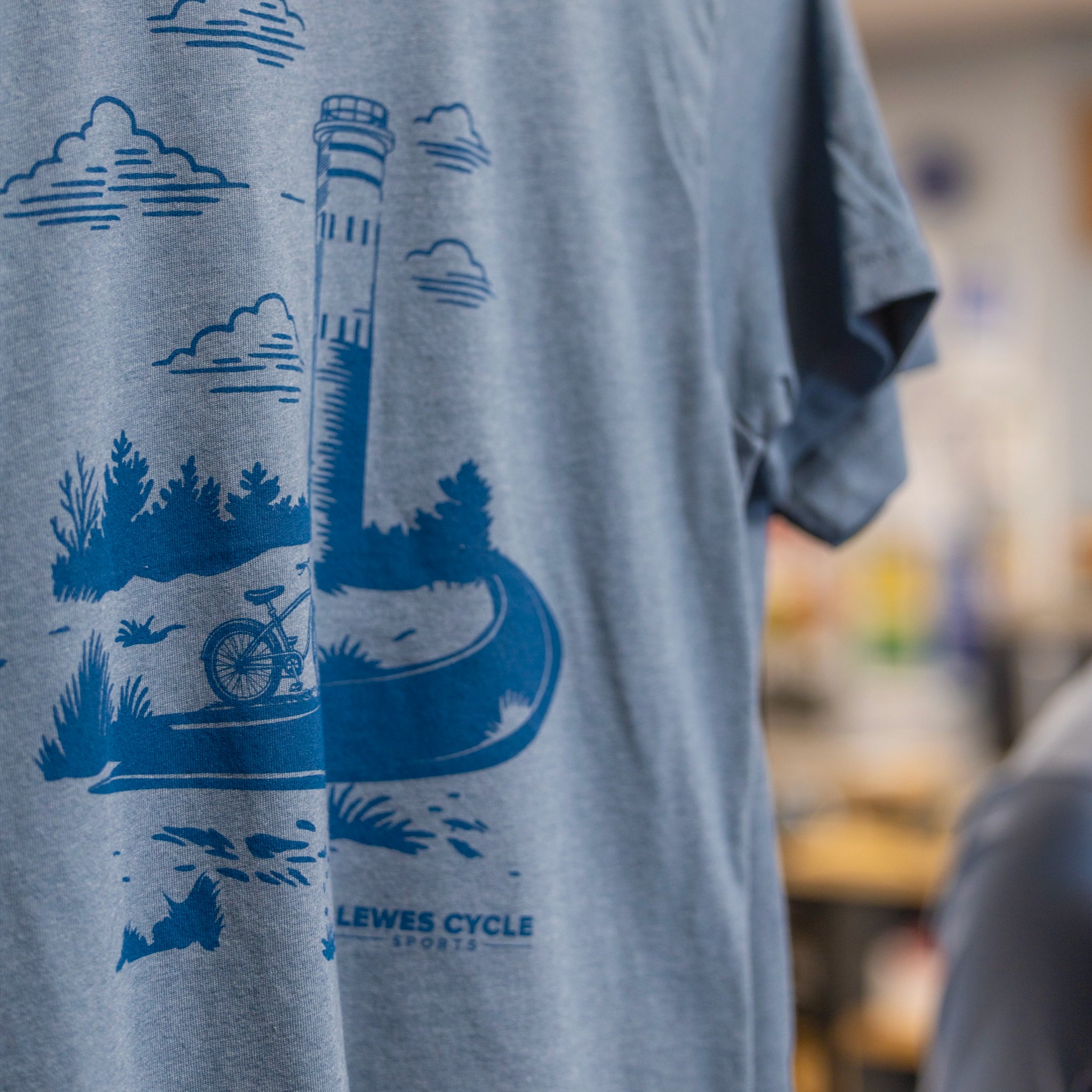 Lewes Cycle Sports tower tee shirt in blue featuring Cape Henlopen Fort Miles observation tower design