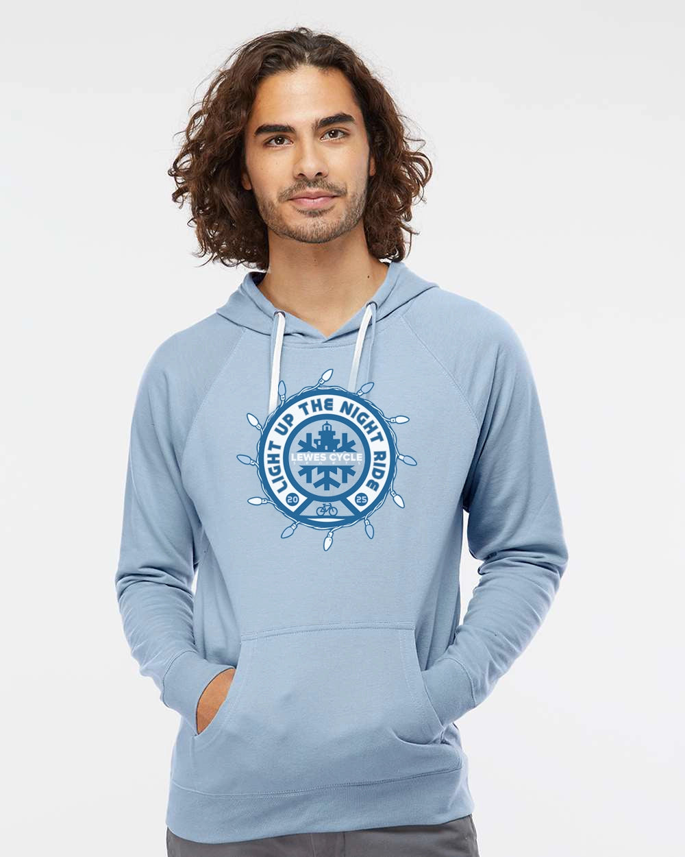 Person wearing the Lewes Lights Holiday Bike Ride hoodie from Lewes Cycle Sports, celebrating the Light Up the Night community bike ride.