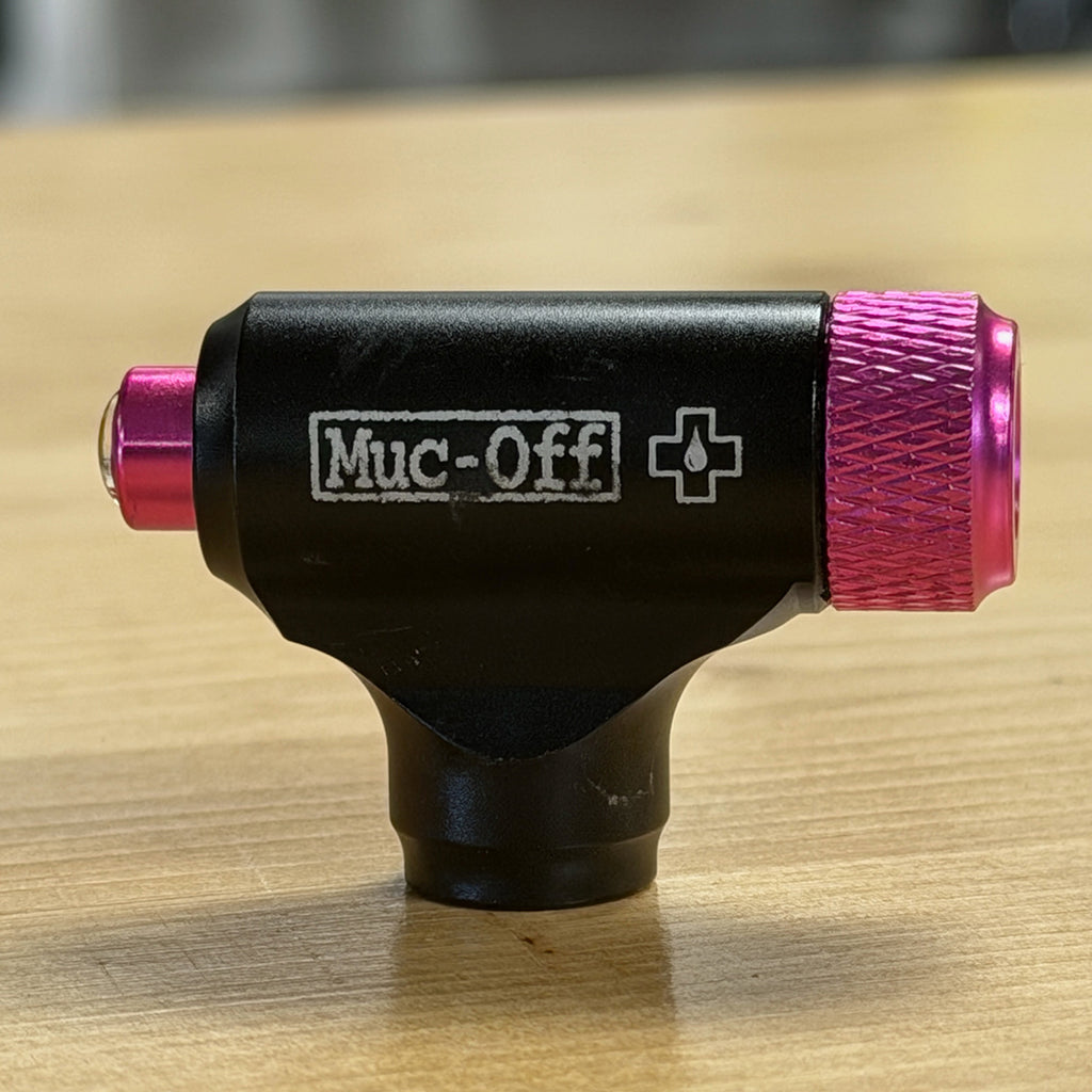 Muc-Off CO2 inflator head CNC aluminum on table