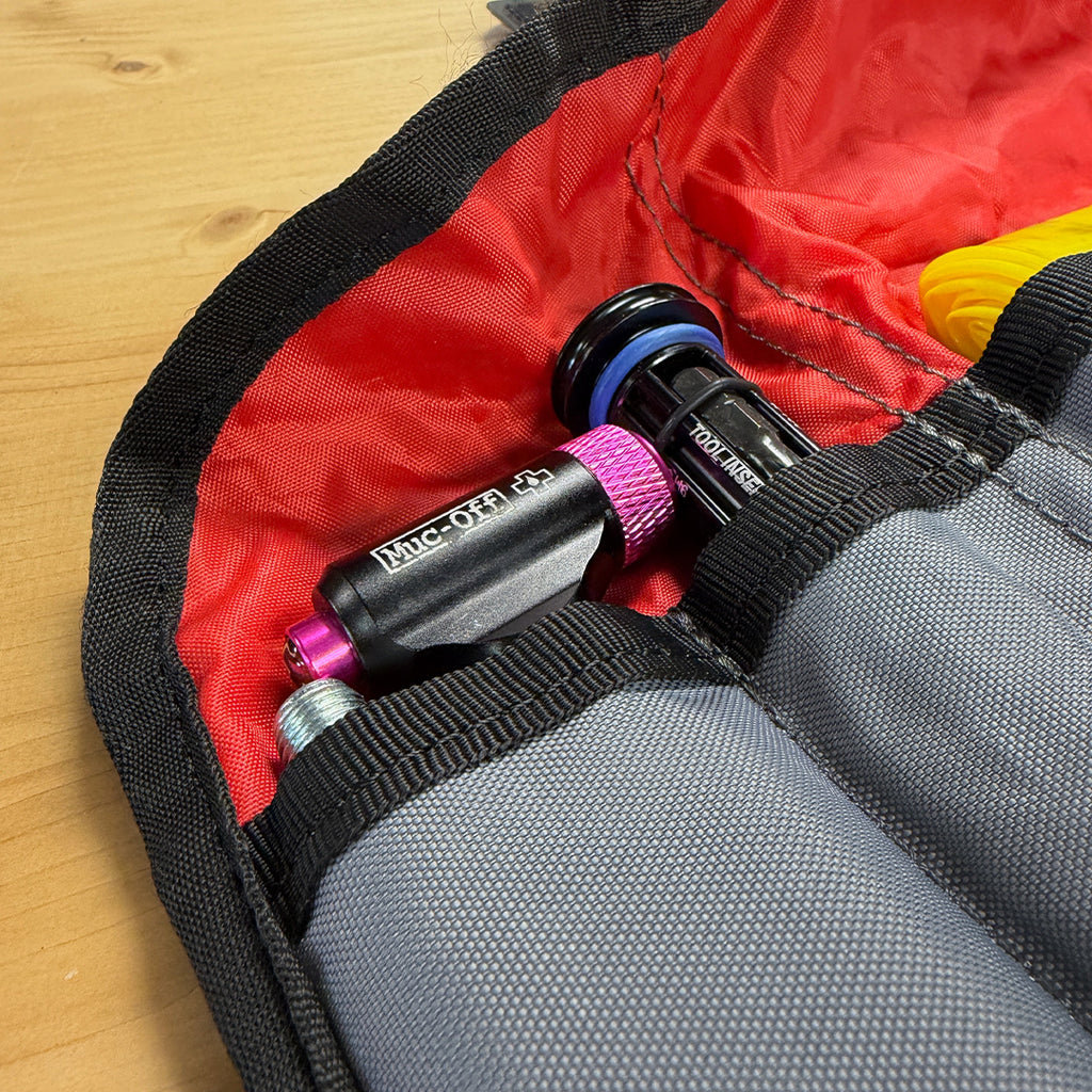 Muc-Off Road CO2 Inflator Kit stored in saddle bag