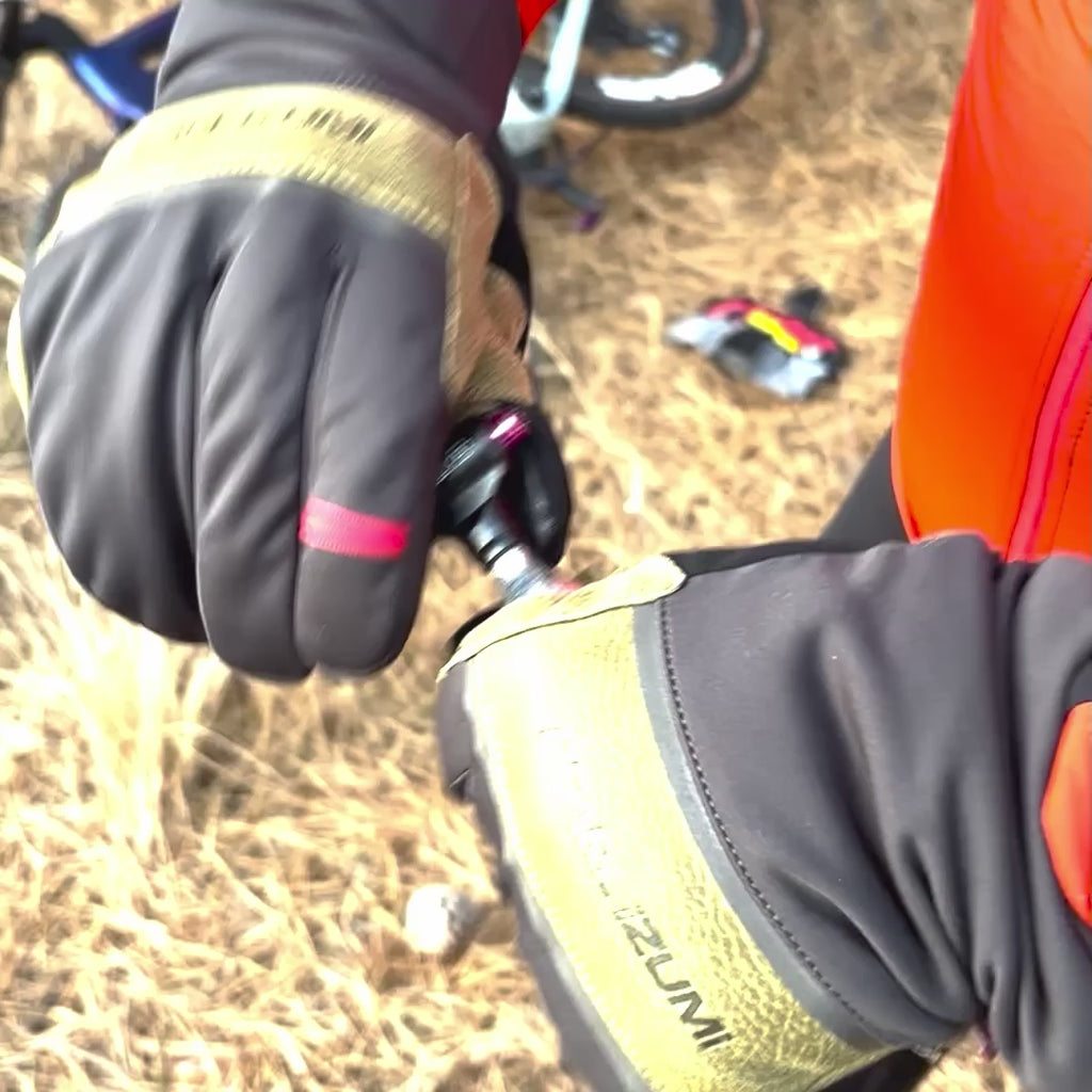 Muc-Off Road CO2 Inflator Kit being used to inflate tire roadside