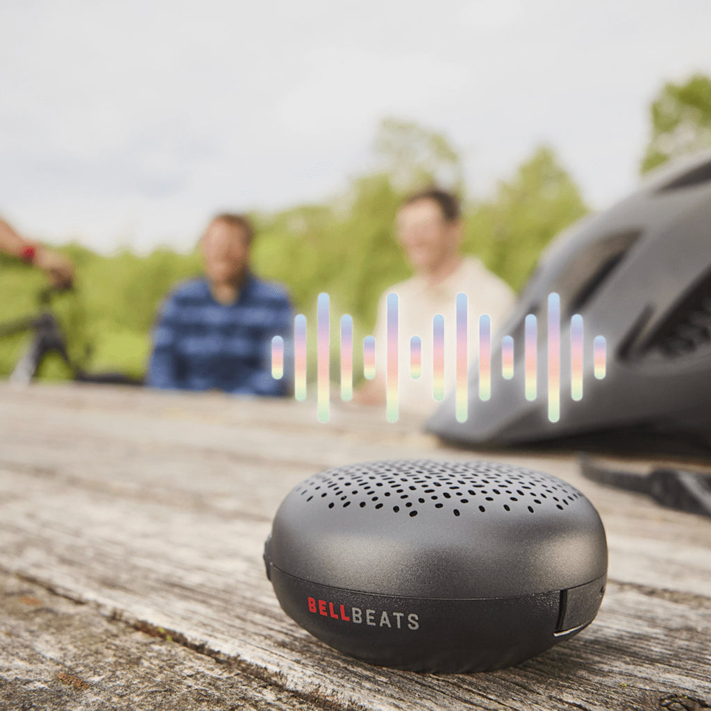 Trek BellBeats Bluetooth speaker playing music on picnic table outdoors
