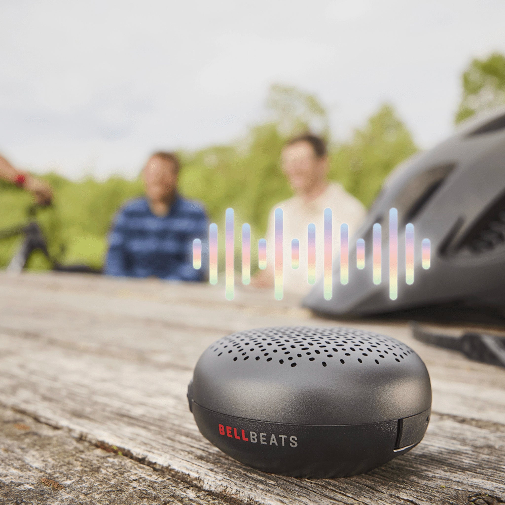 Trek BellBeats Bluetooth speaker playing music on picnic table outdoors